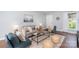 Cozy living room with hardwood floors, neutral colors, and comfortable furniture at 4329 Hathaway St # D, Charlotte, NC 28211