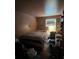 Modest bedroom with hardwood floors featuring a bed, window with natural light, and a dresser at 4414 Birkdale Dr, Charlotte, NC 28208