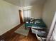 Bedroom with hardwood floors, window, and neutral paint at 4414 Birkdale Dr, Charlotte, NC 28208