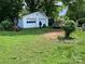 Two-car white garage with lawn, vintage truck, and exterior view at 4414 Birkdale Dr, Charlotte, NC 28208