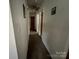 Neutral hallway with carpet, doors, and ceiling fan at 4414 Birkdale Dr, Charlotte, NC 28208
