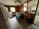 Eat-in kitchen featuring wood paneling, appliances, and linoleum flooring at 4414 Birkdale Dr, Charlotte, NC 28208