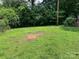 Lawn backyard with trees and an open space to build at 4414 Birkdale Dr, Charlotte, NC 28208