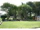 Spacious backyard featuring mature trees, manicured landscaping, and lawn at 4711 Lenox Hill Pl # 98, Charlotte, NC 28269