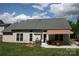 Back of house with a covered patio, grill, manicured lawn and cactus garden at 4711 Lenox Hill Pl # 98, Charlotte, NC 28269