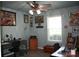 Bright bedroom featuring a ceiling fan with lighting and lots of decor on the walls at 4711 Lenox Hill Pl # 98, Charlotte, NC 28269