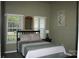 A serene bedroom with natural light provides a relaxing retreat, perfect for relaxation and restful sleep at 4711 Lenox Hill Pl # 98, Charlotte, NC 28269