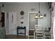 Dining area featuring a table with chairs, wood floors, and views into the kitchen at 4711 Lenox Hill Pl # 98, Charlotte, NC 28269