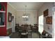Cozy dining room featuring a wooden table and a decorative chandelier at 4711 Lenox Hill Pl # 98, Charlotte, NC 28269