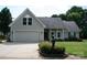 Charming home featuring an attached garage, covered front porch, and well maintained landscaping at 4711 Lenox Hill Pl # 98, Charlotte, NC 28269