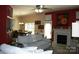 Spacious living room with a fireplace, neutral sofa, and view to dining area at 4711 Lenox Hill Pl # 98, Charlotte, NC 28269