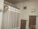 Well-maintained shower stall, complete with modern fixtures and a new shower curtain, ready to provide comfortable experience at 4711 Lenox Hill Pl # 98, Charlotte, NC 28269