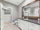 Well-appointed bathroom with a granite vanity, walk-in closet, and a shower-tub at 5030 Waldron Meadow Dr, Charlotte, NC 28226