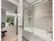 Modern bathroom featuring a shower over the bath with stylish tiling and glass screen at 5030 Waldron Meadow Dr, Charlotte, NC 28226