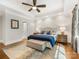Beautiful bedroom featuring hardwood floors, tray ceilings, a ceiling fan, and neutral paint at 5030 Waldron Meadow Dr, Charlotte, NC 28226