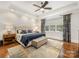 Bedroom features include hardwood floors, ceiling fan, neutral paint, and tray ceiling at 5030 Waldron Meadow Dr, Charlotte, NC 28226