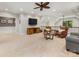 Bonus room with ceiling fan, TV, sitting area, and great natural light at 5030 Waldron Meadow Dr, Charlotte, NC 28226