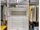 Organized walk-in closet with custom shelves, drawers, and hanging rods for ample storage space at 5030 Waldron Meadow Dr, Charlotte, NC 28226
