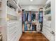 Spacious walk-in closet with custom shelving and wood floors at 5030 Waldron Meadow Dr, Charlotte, NC 28226