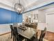 Open dining room layout connecting to the kitchen, with an elegant table and hardwood floors at 5030 Waldron Meadow Dr, Charlotte, NC 28226