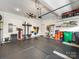 Well-equipped garage with gym equipment and ample storage space, perfect for fitness enthusiasts at 5030 Waldron Meadow Dr, Charlotte, NC 28226