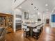 Bright kitchen features a large island with barstool seating, stainless steel appliances, and hardwood floors at 5030 Waldron Meadow Dr, Charlotte, NC 28226