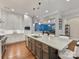 Open kitchen features an island with barstool seating and stainless steel appliances at 5030 Waldron Meadow Dr, Charlotte, NC 28226