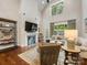 Open concept living room with fireplace, high ceilings, large windows and natural light at 5030 Waldron Meadow Dr, Charlotte, NC 28226