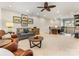 Open living room featuring comfortable sofa, armchairs, and a view of the staircase to the upper floor at 5030 Waldron Meadow Dr, Charlotte, NC 28226