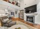 Bright living room with fireplace, high ceilings, wood floors, and an open floor plan at 5030 Waldron Meadow Dr, Charlotte, NC 28226