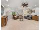 Cozy living room with ceiling fan, comfortable seating, and natural light, perfect for relaxation at 5030 Waldron Meadow Dr, Charlotte, NC 28226