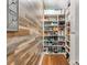 Walk-in pantry with custom shelving and beautiful wood-look accent wall at 5030 Waldron Meadow Dr, Charlotte, NC 28226