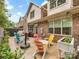 Inviting outdoor patio with colorful chairs and lush landscaping perfect for relaxation and entertainment at 5030 Waldron Meadow Dr, Charlotte, NC 28226