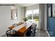 Well-lit dining room presents a wood table, six chairs, and picturesque outdoor view at 545 Trading Post Ln, York, SC 29745
