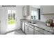 Modern kitchen featuring granite counters, stainless appliances, and a door to the outdoors at 545 Trading Post Ln, York, SC 29745