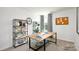 Bright home office with a modern desk, decorative shelving, and patterned curtains at 545 Trading Post Ln, York, SC 29745