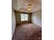 Cozy bedroom features a ceiling fan and natural light from the window at 5523 Stone Bluff Ct, Charlotte, NC 28214