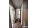 Hallway leads into other rooms with neutral-toned walls and carpet at 5523 Stone Bluff Ct, Charlotte, NC 28214