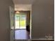 Living area leading to a backyard with a sliding door at 5523 Stone Bluff Ct, Charlotte, NC 28214