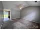 Cozy living room with neutral walls and a ceiling fan at 5523 Stone Bluff Ct, Charlotte, NC 28214