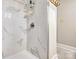 Modern bathroom featuring marble tiling, a shower with glass door, and updated fixtures and finishes at 5611 Charter Oaks Ln, York, SC 29745
