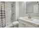 Modern bathroom features a marble tiled standup shower and a white vanity at 5611 Charter Oaks Ln, York, SC 29745