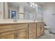 Bathroom with a double sink vanity, large mirror, and natural lighting at 5611 Charter Oaks Ln, York, SC 29745
