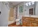 Full bathroom with updated vanity, shower-tub combo with curtain, and a window providing natural light at 5611 Charter Oaks Ln, York, SC 29745