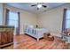 A serene bedroom with hardwood floors, natural light, and a comfortable queen size bed at 5611 Charter Oaks Ln, York, SC 29745
