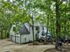 Charming two-story home with three-car garage and wooden deck, surrounded by mature shade trees at 5611 Charter Oaks Ln, York, SC 29745