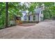 Side exterior of home with white siding, a driveway, and a two-car garage at 5611 Charter Oaks Ln, York, SC 29745
