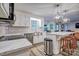 Modern kitchen with white cabinets, a stainless steel sink, and an island with seating at 5611 Charter Oaks Ln, York, SC 29745