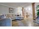 Comfortable living room with hardwood style floors, neutral-toned furniture, and views to the entry stairs at 5611 Charter Oaks Ln, York, SC 29745