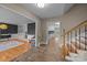 Open foyer leading to the kitchen, living room, and stairs at 6017 Sierra Dr, Charlotte, NC 28216